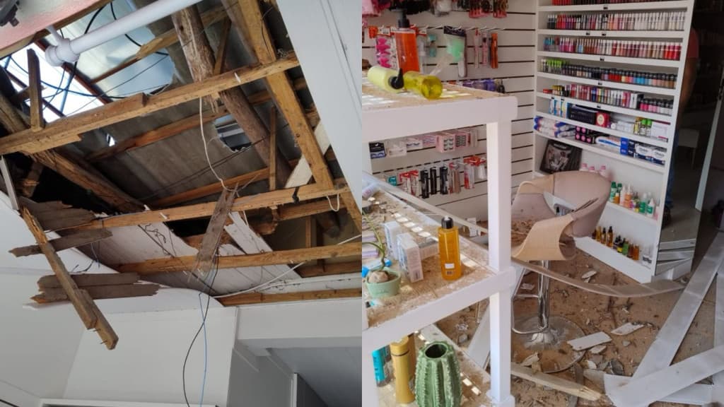 Placa de publicidade cai sobre loja de cosméticos e mobiliza bombeiros