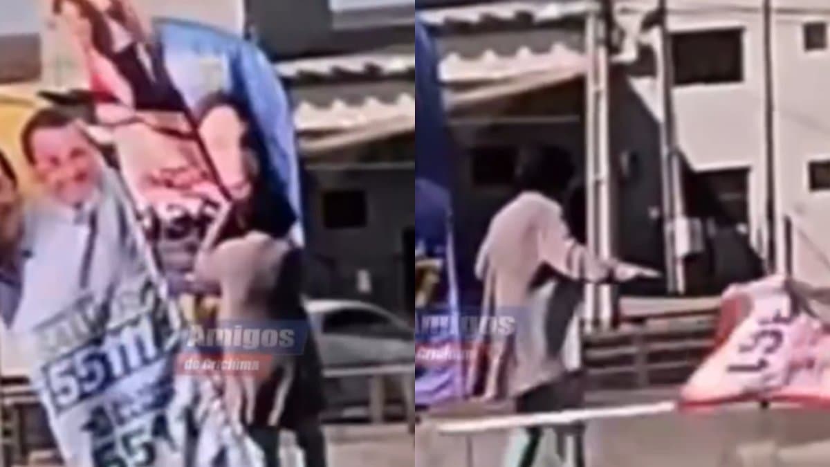 Bandeira do PT com imagens de Lula e da candidata Jucelia Vargas sendo arrancada da calcada da Avenida Centenario, em Criciuma