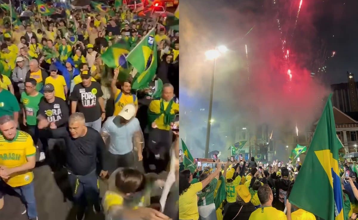 Debaixo de chuva, apoiadores de Flávio Bolsonaro fazem ato com fogos e bandeiras pelas ruas de Joinville
