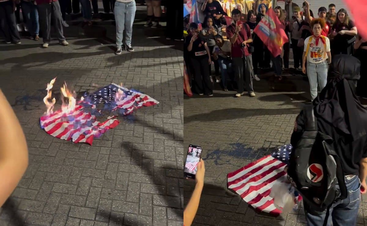 Manifestantes de extrema-esquerda queimam bandeira dos Estados Unidos durante ato por Lula em Blumenau