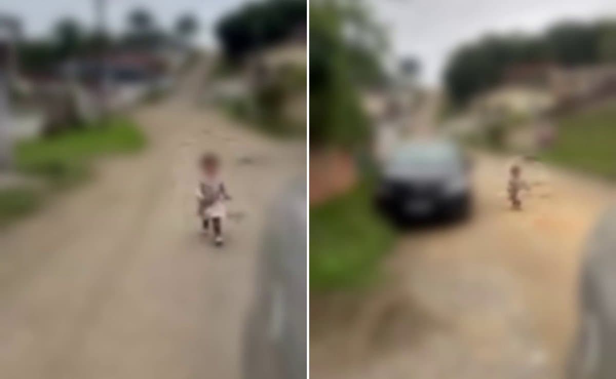 Menina de cerca de 2 anos é flagrada sozinha no meio da rua e corre atrás de carro em Santa Catarina