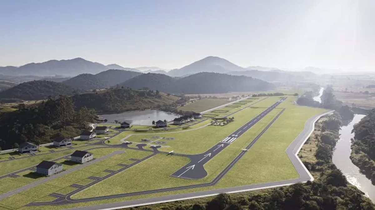 Render aéreo do projeto: pista ampliada e condomínio aeronáutico