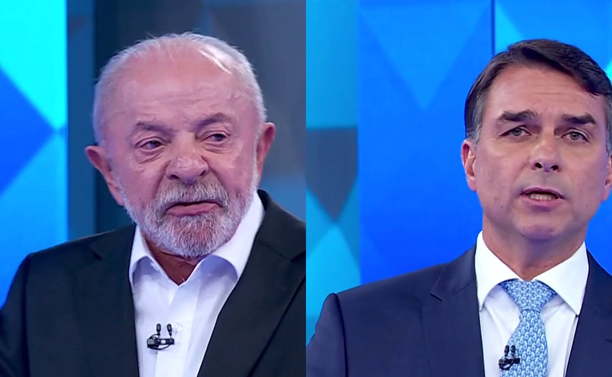 Lula provoca Flávio sobre salário mínimo e ouve: “dá com uma mão e tira com os nove dedos”